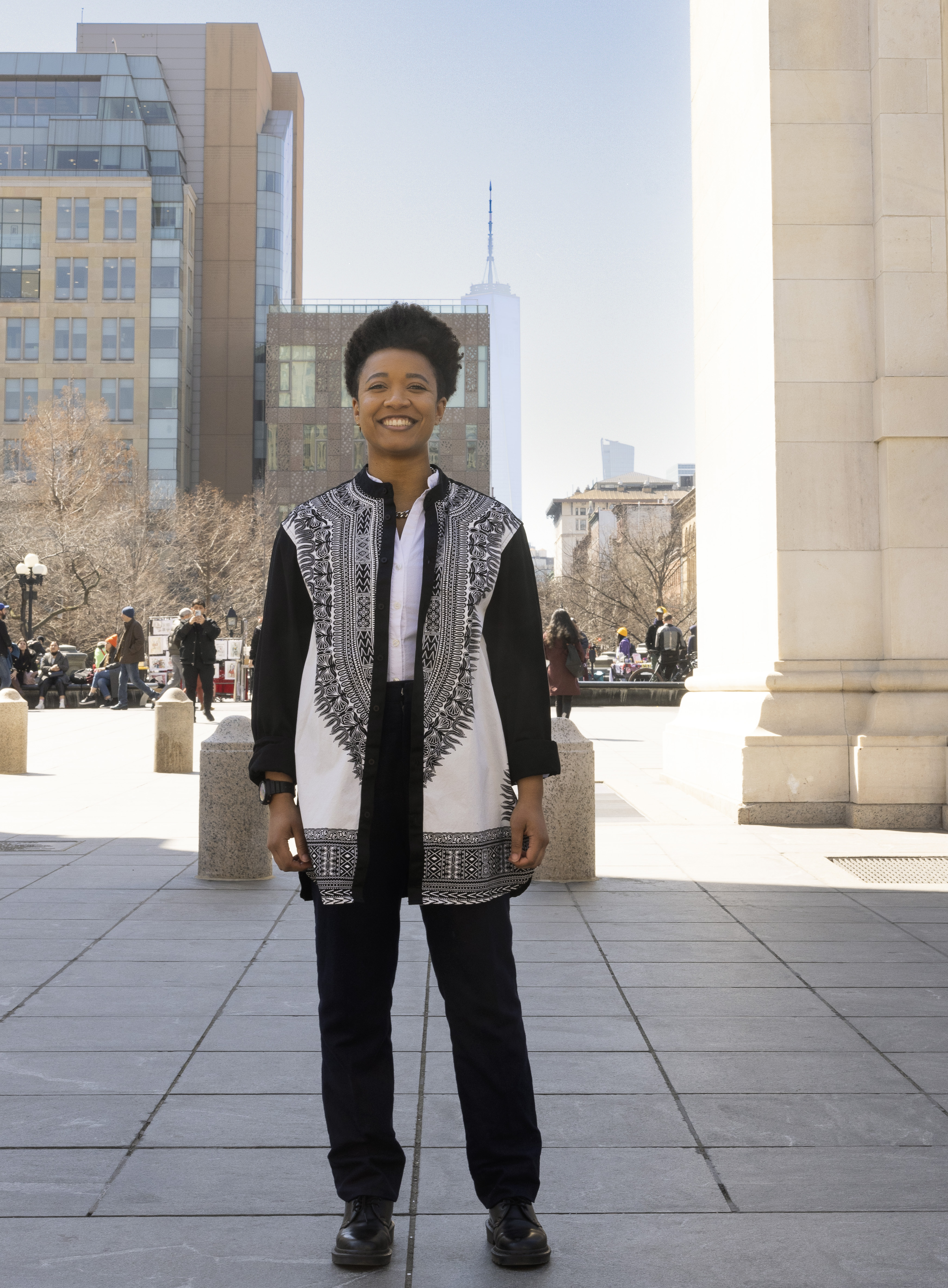Photo of person in black and white payments outside