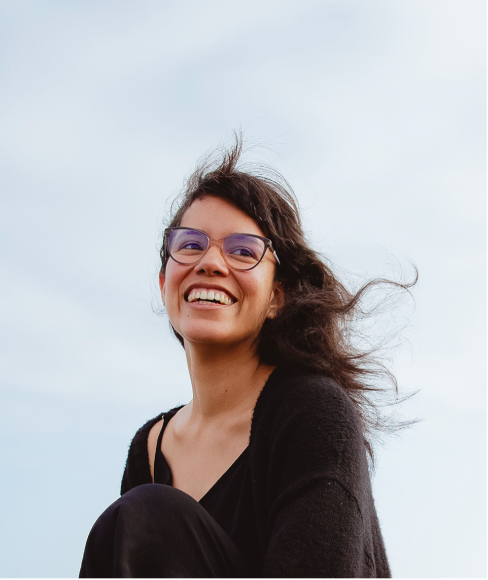 Photo of person in glasses smiling 