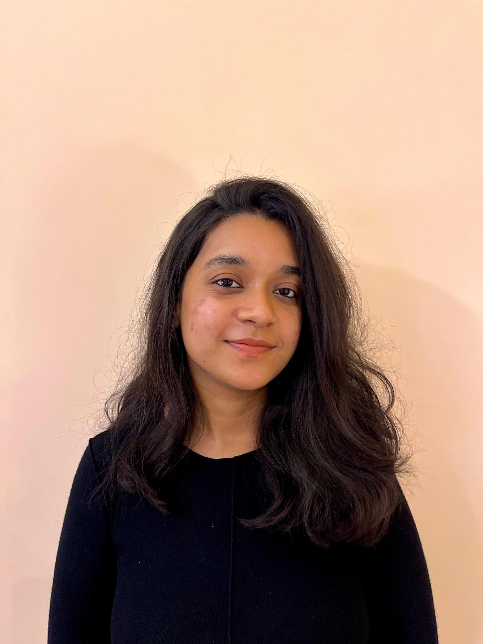 Photo of smiling woman with dark hair
